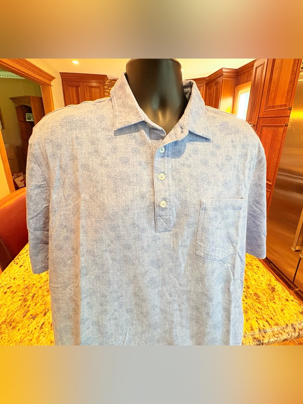 johnnie-O men’s golf polo. Subtle Floral print with logo.